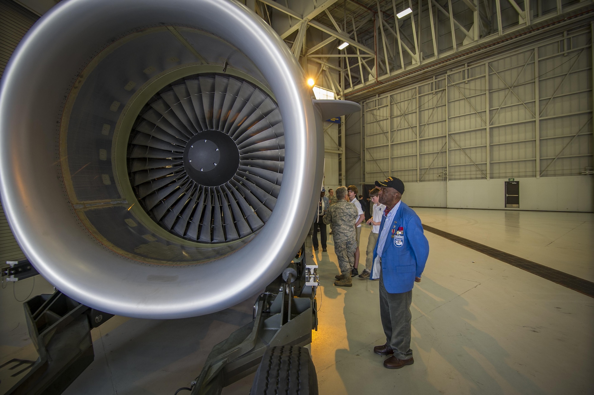 (Ret.) Lt. Col. Enoch “Woody” Woodhouse observes the engine of a C-17 Globemaster III Feb. 23, 2017, during the Tuskegee Airmen Career Day at Joint Base Charleston, S.C. Woodhouse has worked as a trial lawyer in Boston for more than 40 years, and is a highly decorated combat veteran. In 2007, he received the Medal of Honor, along with other Tuskegee Airmen, by President George W. Bush for facing “two wars: one abroad and the other at home in terms of racial intolerance.” (U.S. Air Force photo by Senior Airman Tom Brading)