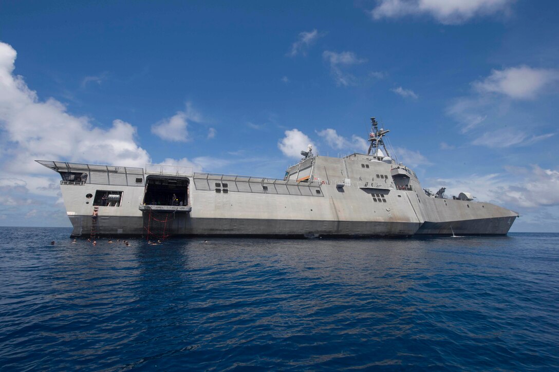 Sailors assigned to the littoral combat ship USS Coronado swim in the South China Sea, Feb. 23, 2017. Coronado is a fast and agile warship tailor-made to patrol the region's littorals and work with partner navies, providing the U.S. 7th Fleet with the flexible capabilities it needs now and into the future. Navy photo by Petty Officer 2nd Class Amy M. Ressler