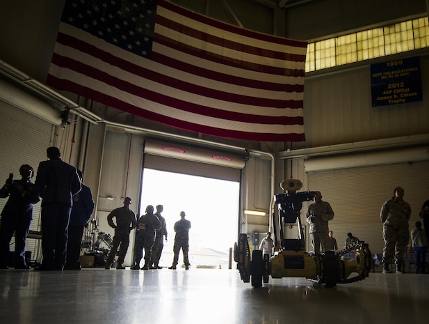 A remotely operated robot, typically used by members of the Explosive Ordnance Disposal flight at Joint Base Charleston, S.C., stands idly as students from 17 schools across the Lowcountry attend the second-annual Tuskegee Airmen Career Day at Joint Base Charleston, S.C. More than 150 students from middle and high school boys from 17 Lowcountry school visited Joint Base Charleston Feb. 23, 2017, to learn about jobs in aviation as part of the second annual Tuskegee Airmen Career Day, hosted by the 315th Airlift Wing. The boys were able to learn about military and civilian careers in aviation by more than 15 different career fields. (U.S. Air Force photo by Senior Airman Tom Brading)