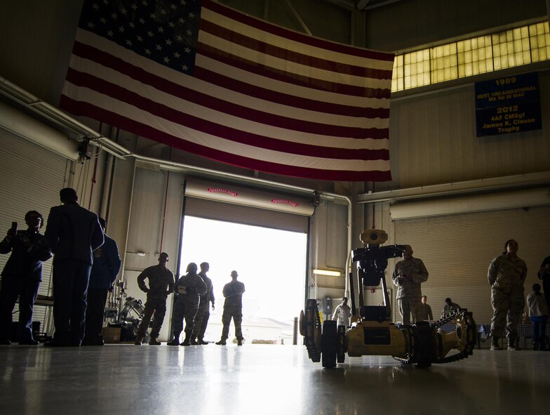 A remotely operated robot, typically used by members of the Explosive Ordnance Disposal flight at Joint Base Charleston, S.C., stands idly as students from 17 schools across the Lowcountry attend the second-annual Tuskegee Airmen Career Day at Joint Base Charleston, S.C. More than 150 students from middle and high school boys from 17 Lowcountry school visited Joint Base Charleston Feb. 23, 2017, to learn about jobs in aviation as part of the second annual Tuskegee Airmen Career Day, hosted by the 315th Airlift Wing. The boys were able to learn about military and civilian careers in aviation by more than 15 different career fields. (U.S. Air Force photo by Senior Airman Tom Brading)