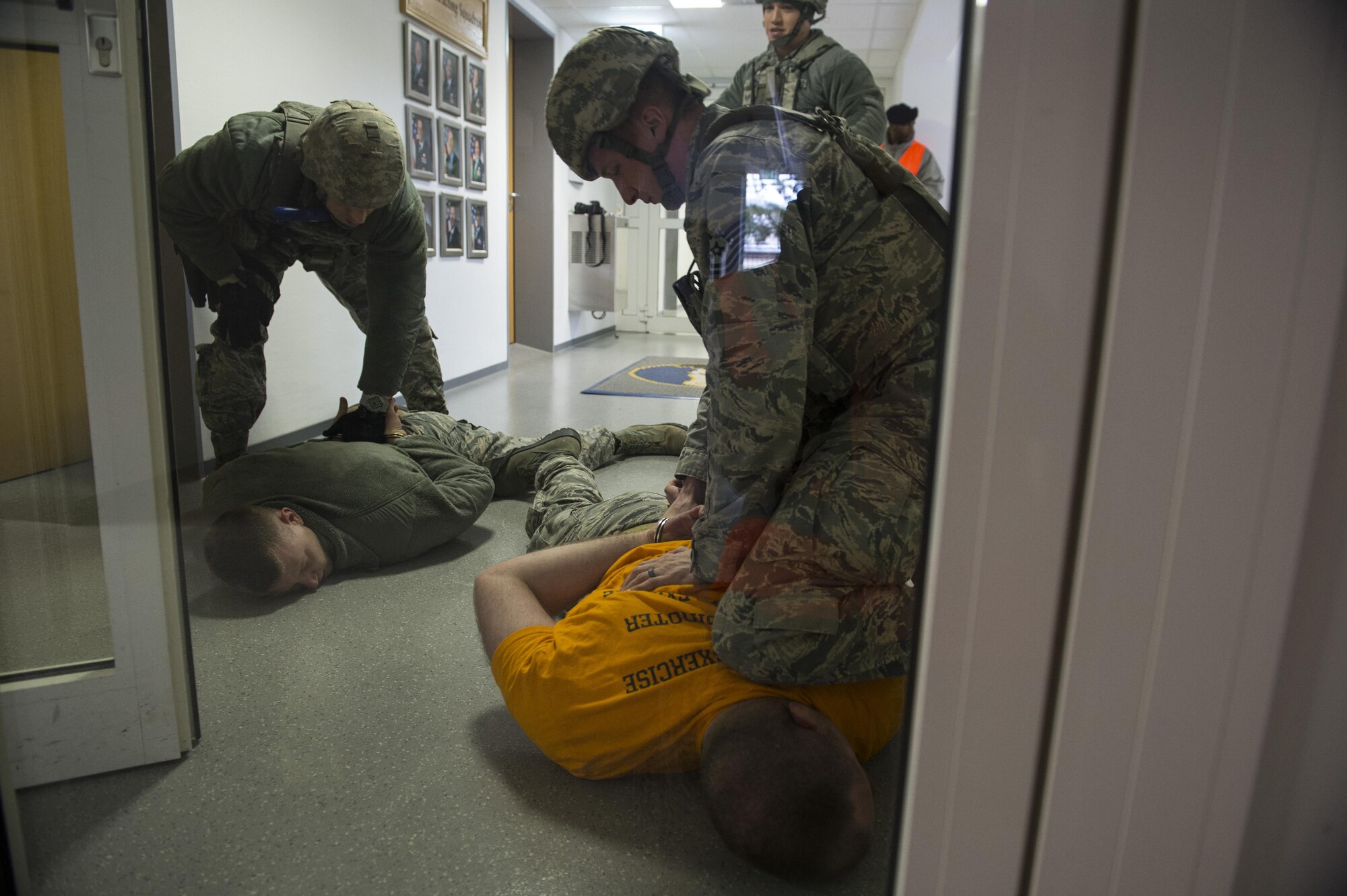 U.S. Air Force Tech. Sgt. Jason Plasner, 52nd Fighter Wing executive assistant to the command chief, acts as an active shooter during an exercise at Spangdahlem Air Base, Germany, Feb. 22, 2017. The realistic scenario involved a disgruntled Airman simulating an active shooter attack on the base. (U.S. Air Force photo by Senior Airman Dawn M. Weber)