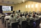 Airmen from Joint Base Andrews, Md., watch an introduction video from Air Force Chief of Staff Gen. David L. Goldfein, to kick off a study on how to revitalize Air Force squadrons Feb. 23, 2017. JB Andrews was chosen as the first base to participate in a three-phase project to meet the chief of staff's No. 1 focus area. (Courtesy photo)