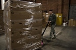 Airman 1st Class Josiah Massari, 92nd Communication Squadron base equipment custodian, places a pallet of equipment in the 92nd CSS warehouse Feb. 17, 2017, at Fairchild Air Force Base. Accountability of items in Information Technology Asset Management is done by scanning numbers on the items and making sure they line up with the numbers in the Automatic Information Manager program.  (U.S. Air Force photo/ Airman 1st Class Sean Campbell)
