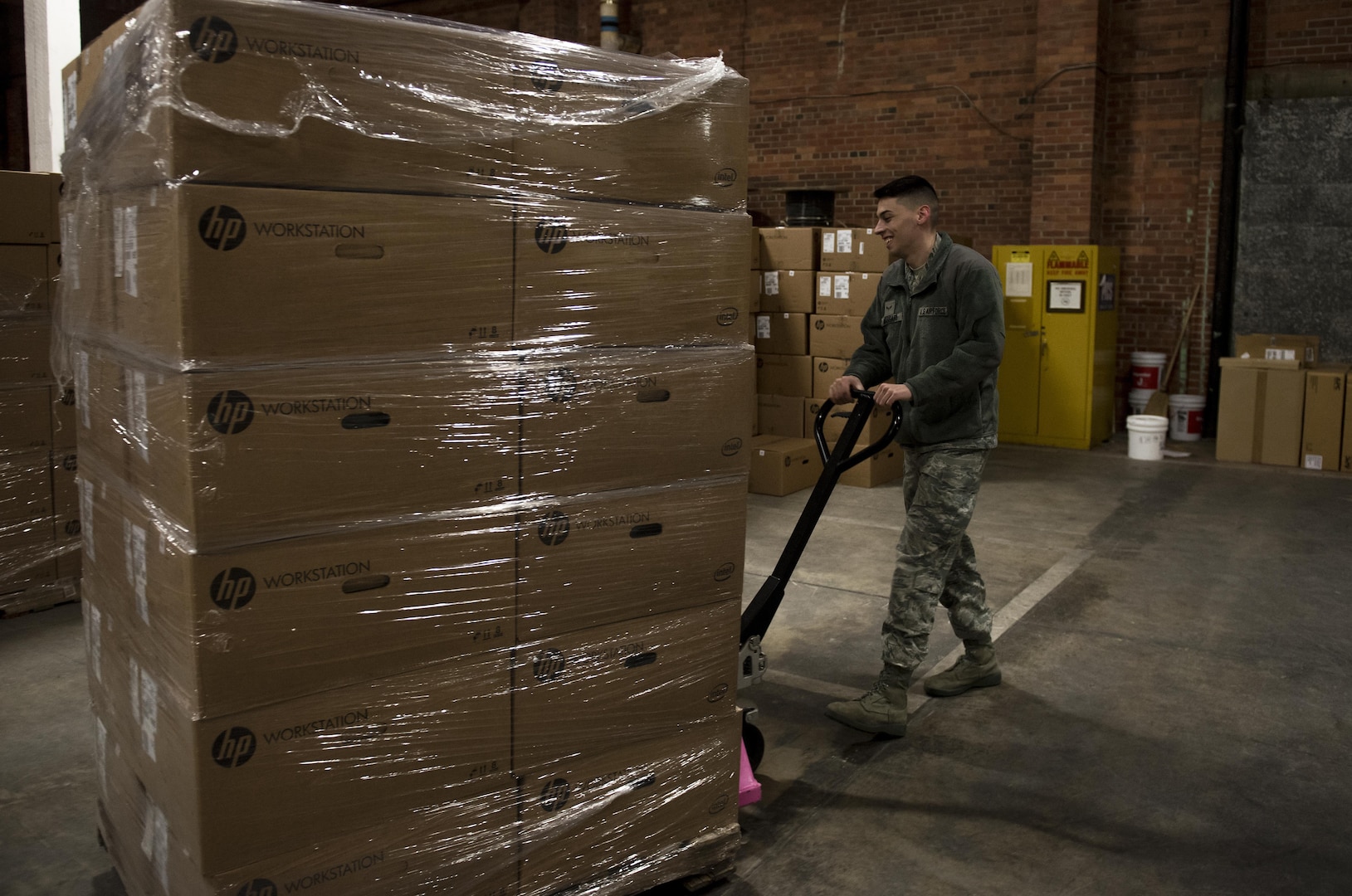 Airman 1st Class Josiah Massari, 92nd Communication Squadron base equipment custodian, places a pallet of equipment in the 92nd CSS warehouse Feb. 17, 2017, at Fairchild Air Force Base. Accountability of items in Information Technology Asset Management is done by scanning numbers on the items and making sure they line up with the numbers in the Automatic Information Manager program.  (U.S. Air Force photo/ Airman 1st Class Sean Campbell)