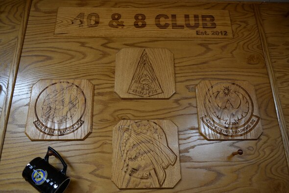 The wall of the 48th Flying Training Squadron heritage room depicts the various patches related to the 48th FTS Feb. 17, 2017, on Columbus Air Force Base, Mississippi. The 48th is one of the oldest squadrons in the Air Force and was created in 1917 in World War I. (U.S. Air Force photo by Senior Airman John Day)