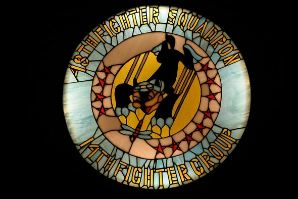A lighted stained-glass mural glows in the 48th Flying Training Squadron heritage room Feb. 17, 2017, on Columbus Air Force Base, Mississippi. The mural depicts the patch of the 48th FTS in its prior incarnation as the 48th Fighter Squadron. (U.S. Air Force photo by Senior Airman John Day)