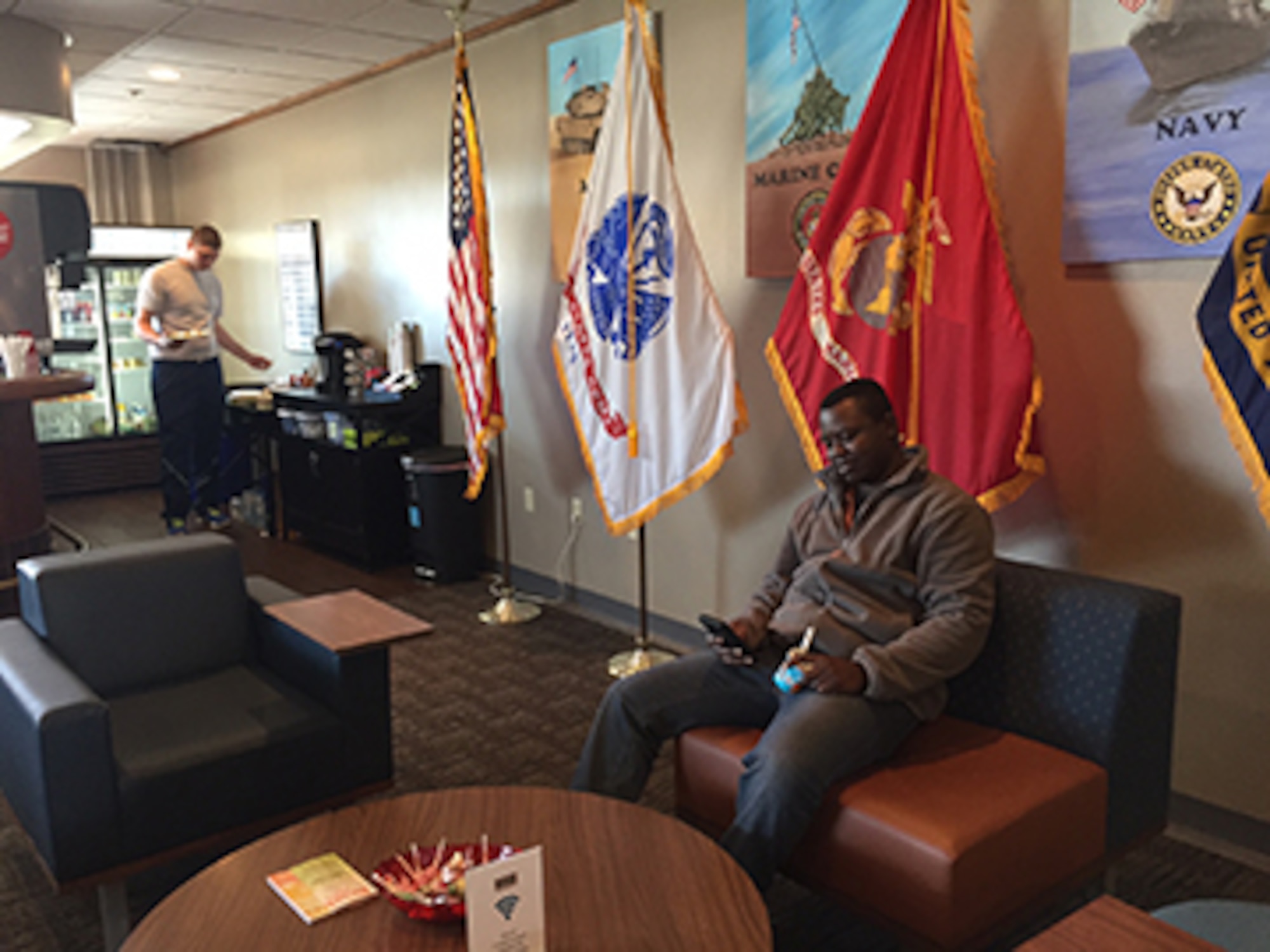 Airman 1st Class Alex B. Brannan, entry controller, 88th Security Forces, left, and Private 1st Class Bernard Dalko, National Air and Space Intelligence Center, enjoy the free Wi-Fi and snacks at the USO Community Center, Bldg. 1222, Kittyhawk Center,Area A, Wright-Patterson Air Force Base.(Skywrighter photo/Amy Rollins)