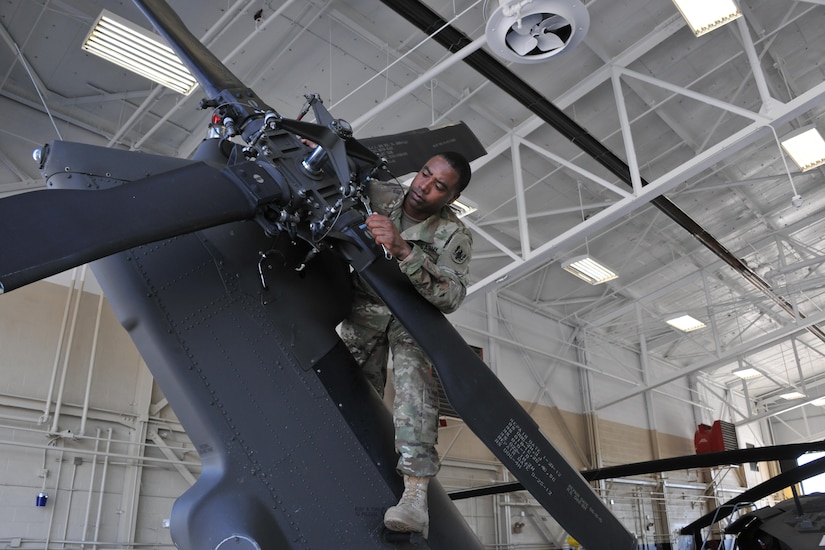 Aircrew members from the Army Reserve Aviation Command conduct pre-flight and maintenance checks on a UH-60 Blackhawk helicopter, Aug. 30. (Photos by Fort Knox Visual Information) 