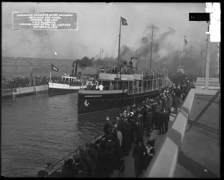 Spectators line the lock walls as the U.S. Army Corps of Engineers vessel Gladwin makes the first lockage through the Davis Lock, October 21, 1914.