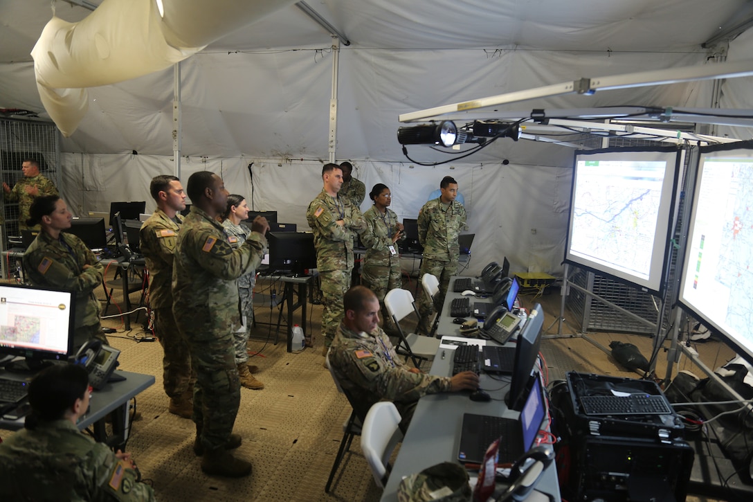 Members of various battle staff elements work to visualize their warfighting functions as part of a User Defined Operational Picture during Cyber Quest 2016 at Fort Gordon, Ga., July 20, 2016. Led by the Army Cyber Center of Excellence, the event's goal was to conduct experimentation to accelerate capabilities that address Army Warfighting Challenge #7 to 'Conduct Space, Cyber Electromagnetic Operations and Maintain Communications.' Army photo by Spc. Kiara V. Flowers