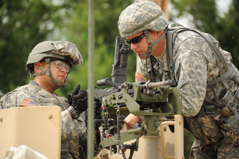 Staff Sgt. Travis Vantine, an Army Reserve soldier with a unit affiliated with the 86th Training Division of Milwaukee, Wis., inspects the mounted weapon of Pfc. Eddie Cordero with the 306th Vertical Engineer Company of Farmingdale, N.Y., during training at Fort McCoy on July 13, 2016. During Operation Cold Steel at Fort McCoy in March and April 2017, Soldiers will complete similar training. 