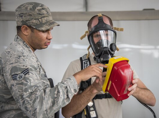 Airmen ensure their detection instrumentation are working properly during a hazardous material portion of an exercise Feb. 22 at Eglin Air Force Base, Fla.  The chemical, biological, nuclear response exercise tested the procedures of emergency response, explosive ordnance disposal, disaster management and bioenvironmental agencies among others.  (U.S. Air Force photo/Samuel King Jr.)