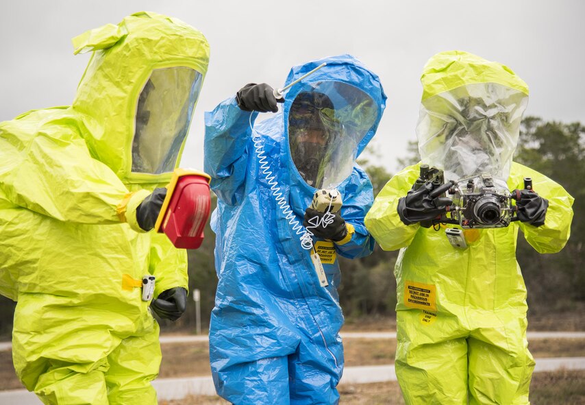 Airmen in protective suits use instruments to detect any hazardous material during an exercise Feb. 22 at Eglin Air Force Base, Fla.  The chemical, biological, nuclear response exercise tested the procedures of emergency response, explosive ordnance disposal, emergency management and bioenvironmental agencies among others.  (U.S. Air Force photo/Samuel King Jr.)