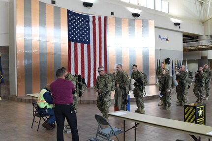 Soldiers assigned to the 207th Engineer Company, Kentucky Army National Guard and the 215th Engineer Company, U.S. Army Reserve are weighed, manifested and processed prior to boarding an aircraft at the Silas L. Copeland Arrival/Departure Airfield Control Group here Feb. 2, 2017 for a deployment in support of Operation Freedom’s Sentinel.