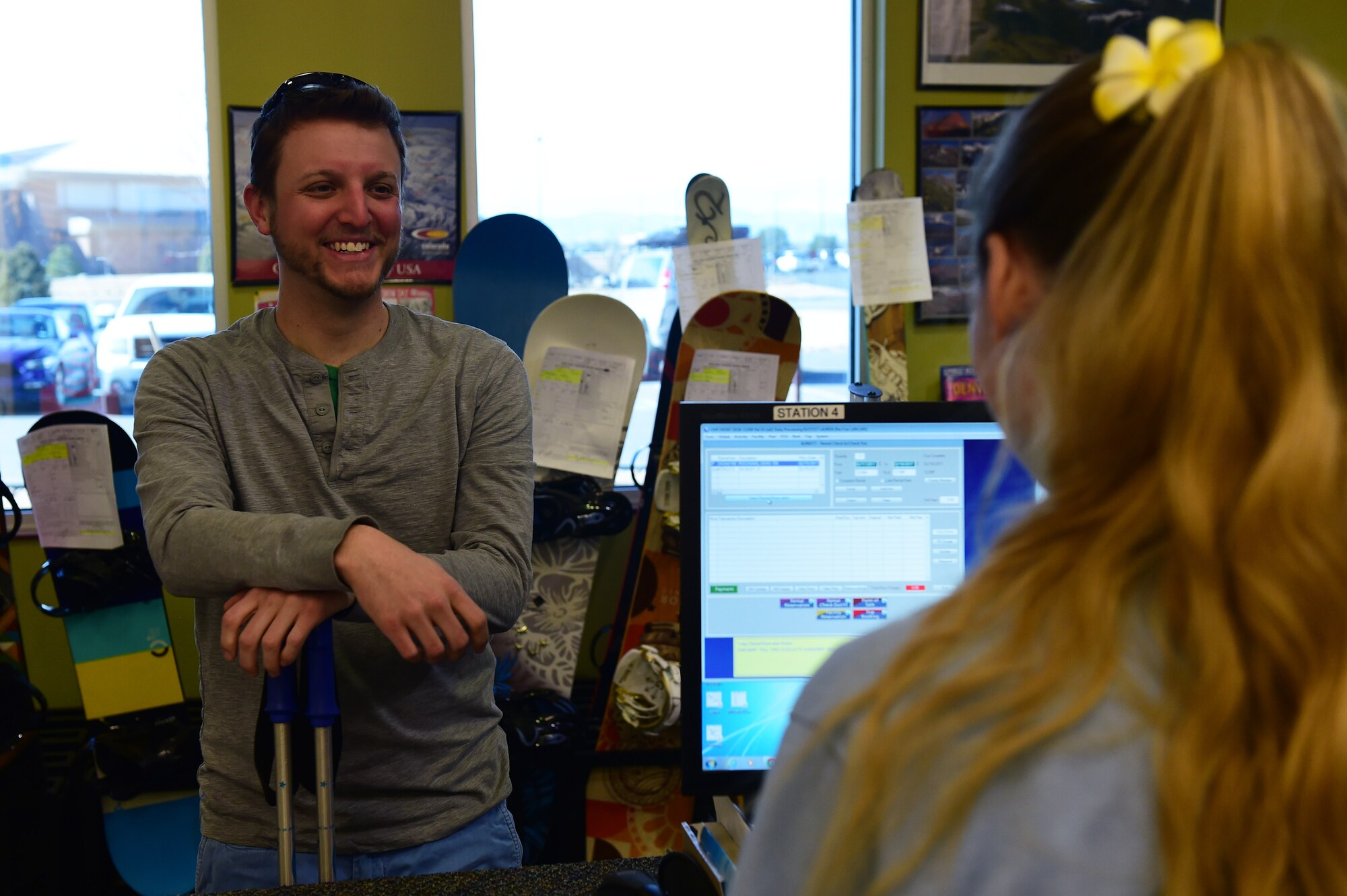 Lt. William Burkett, Coastal Riverine Squadron 11 Delta 1st platoon assistant officer in charge on Naval Base Kitsap-Bangor in Silverdale, WA, is assisted by Lauren Boyer, recreation aid, Feb. 17, 2017, at the outdoor recreation on Buckley Air Force Base, Colo. The ODR is a one-stop-shop for rental equipment, discount tickets and guided trips. (Photo by Airman Jacob Deatherage/Released)