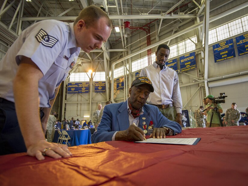 Davontre Wigfall (pictured right), a college student from Mount Pleasant, S.C., was sworn into the U.S. Air Force Reserve by an original Tuskegee Airman, (Ret.) Lt. Col. Enoch Woodhouse during the Tuskegee Airmen Career Day Feb. 23, 2017, at Joint Base Charleston, S.C. Upon graduation from basic training and tech. school, Wigfall will return to the 315th Airlift Wing as a member of the 38th Aerial Port Squadron. (U.S. Air Force photo by Senior Airman Tom Brading)