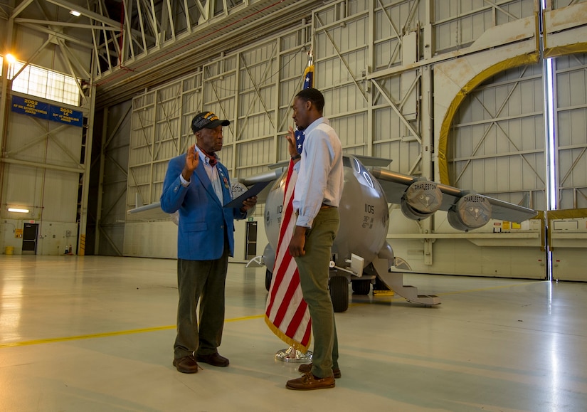(Ret.) Lt. Col. Enoch “Woody” Woodhouse, an original Tuskegee Airman, conducts the Oath of Enlistment ceremony to Davontre Wigfall, a Mount Pleasant native, Feb. 23, 2017, at Joint Base Charleston, South Carolina. Woodhouse was visited the base in conjunction with the Tuskegee Airmen Career Day. Upon graduation from basic training and tech. school, Wigfall will return to the 315th Airlift Wing as a member of the 38th Aerial Port Squadron. (U.S. Air Force photo by Senior Airman Tom Brading)