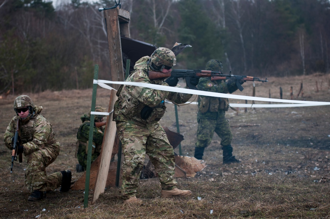 U.S. Army and Canadian engineers secure a mock building after using an explosive charge to breach a door while training with Ukrainian combat training center engineers near Yavoriv, Ukraine, Feb. 24, 2017. Army photo by Sgt. Anthony Jones