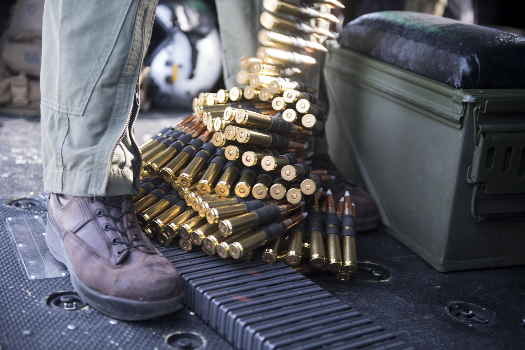A UH-1Y Venom crew chief with the Marine Light Attack Helicopter Squadron 773, loads and prepares a GAU-21 .50 caliber machine gun for a training exercise at Joint Base McGuire-Dix-Lakehurst, New Jersey, Feb. 22, 2017. The exercise included simulated insertion and extraction, gunnery training and nighttime training.