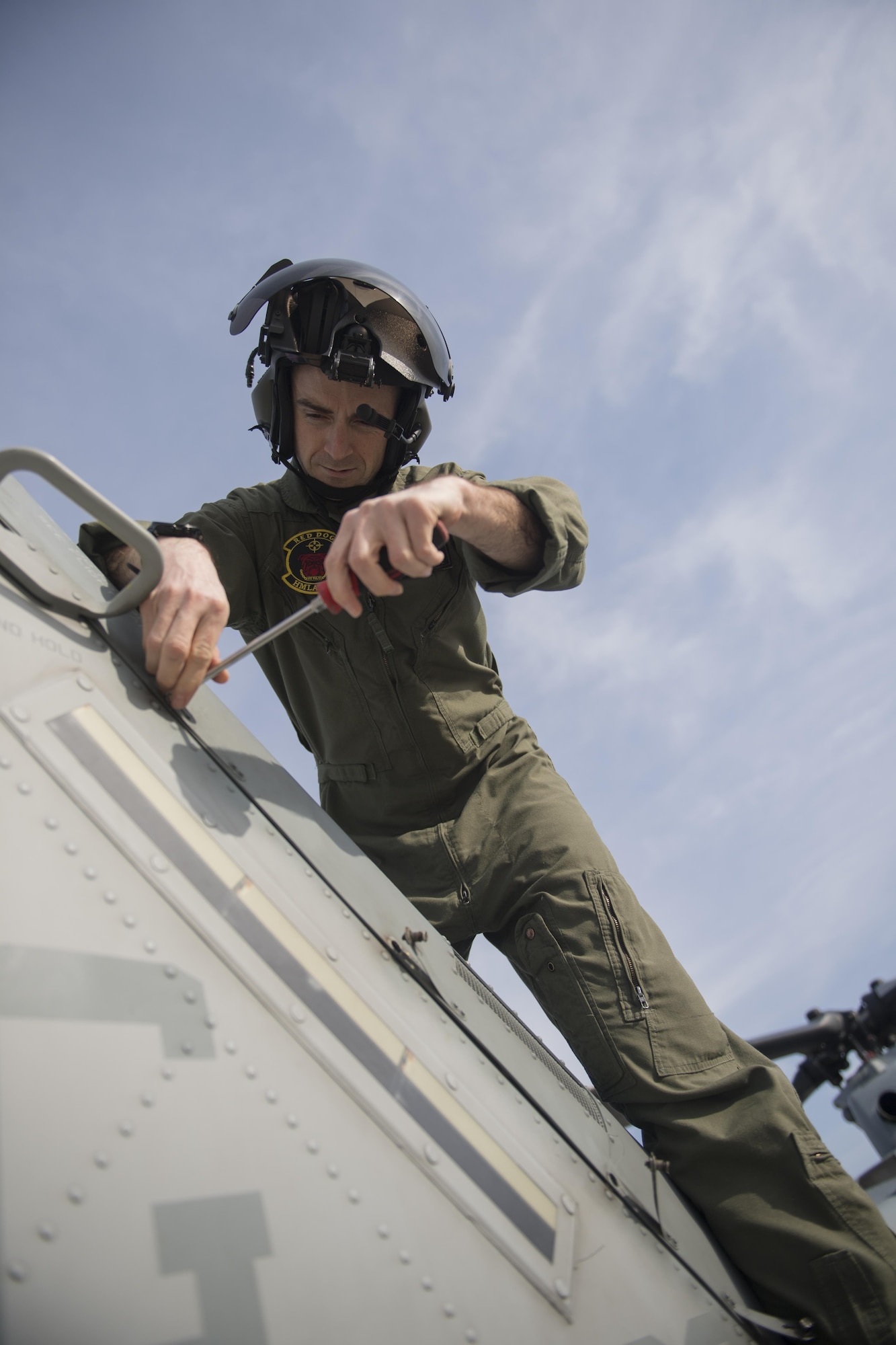 Capt. Jacob Schwam, a UH-1Y Venom pilot with the Marine Light Attack Helicopter Squadron 773, performs preflight checks at Joint Base McGuire-Dix-Lakehurst, New Jersey, Feb. 22, 2017. Schwam and his crew participated in flight and gunnery training exercises on the ranges here.