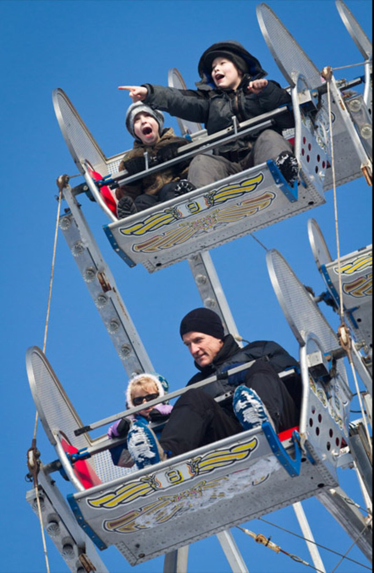 Families ride a Ferris wheel at the Rondy Carnival during the annual Fur Rendezvous winter festival in Anchorage. This year the festival takes place Feb. 24 to March 5 and the carnival is open daily throughout the event. 