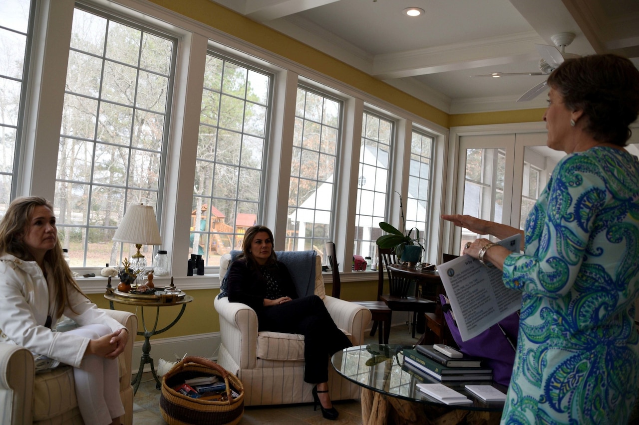 Barbara Livingston, wife of Army Maj. Gen. Robert E. Livingston, South Carolina’s adjutant general, meets with Yuli Nunez de Bueno, wife of Colombian Air Force Commander Gen. Carlos Eduardo Bueno Vargas, and Monica Ochoa de Rueda, wife of Colombian Air Force Col. Juan Carlos Rueda Cartagena, for a family support discussion in Gaston, S.C., Feb, 21, 2017. The gathering was part of Bueno's visit with key leaders in the South Carolina National Guard and State Partnership Program and an opportunity for the spouses to exchange ideas about caring for military families. Bueno was visiting South Carolina during a two-day stop to meet National Guard leadership in aviation and tour McEntire Joint National Guard Base in Eastover, S.C., prior to heading to Washington, D.C. to meet with the chief of National Guard Bureau and the Air Force chief of staff. South Carolina National Guard photo by Army Lt. Col. Cindi King