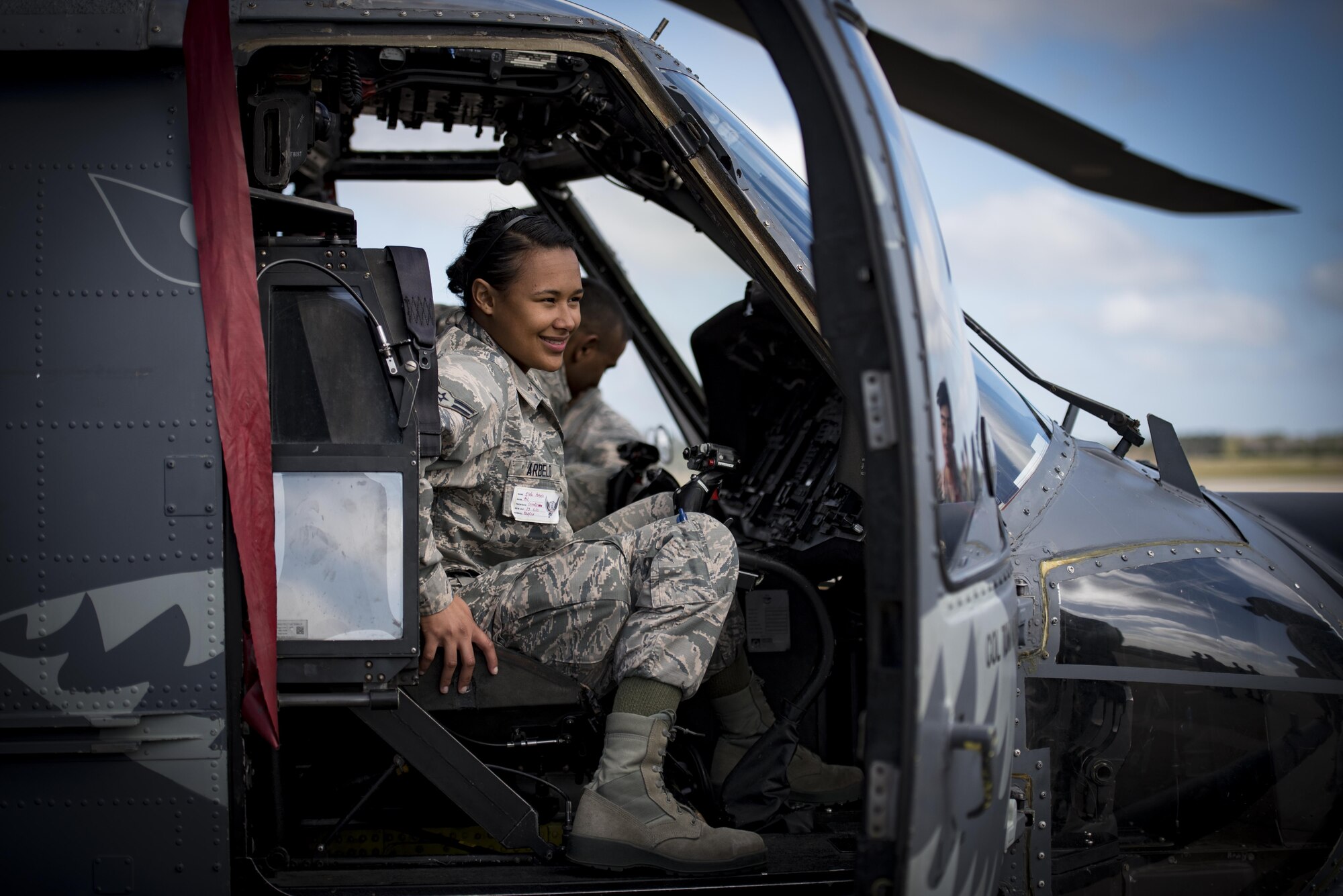 Airman 1st Class Elida Arbelo, 23d Operations Support Squadron intelligence analyst, sits in the cockpit of an HH-60G Pave Hawk, Feb. 23, 2017, at Moody Air Force Base, Ga. During the base tour segment of the new in-processing program known as “On-boarding,” Airmen and their families visited the 23d Medical Group, the 820th Base Defense Group, the HH-60G Pave Hawks and A-10C Thunderbolt IIs. (U.S. Air Force photo by Airman 1st Class Lauren M. Sprunk)