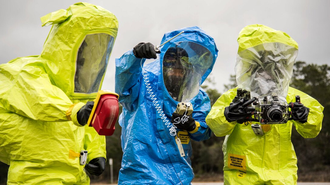 Airmen in protective suits use instruments to detect hazardous materials during a chemical, biological and nuclear response exercise at Eglin Air Force Base, Fla., Feb. 22, 2017. Air Force photo by Samuel King Jr.
