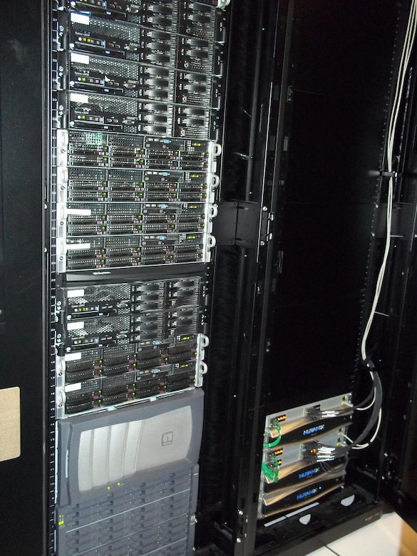 Pictured on the left is a rack that housed servers, switches and storage area network devices previously used to manage storage for the Organizational Messaging Service. The Hyper-Converged Infrastructure system pictured on the right, is a virtualization solution that replaces traditional servers, and combines storage and compute functions into a single machine to save cost, energy and space. Marine Corps Systems Command’s Information Systems and Infrastructure recently installed the technology at Camp Lejeune, North Carolina, and Camp Pendleton, California, to support OMS, which is used to send operational and administrative messages across the Corps. (Courtesy photo)
