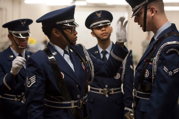 Members of the Ellsworth Honor Guard inspect each other’s uniforms before presenting the colors during a performance by the Offutt Brass at the Performing Arts Center Historic Theater in Rapid City, S.D., on Feb. 22, 2017. Offutt Brass is the brass ensemble of the U.S. Air Force Heartland of America Band that performs around the U.S. to celebrate America and patriotism. (U.S. Air Force photo by Airman 1st Class Randahl J. Jenson) 
