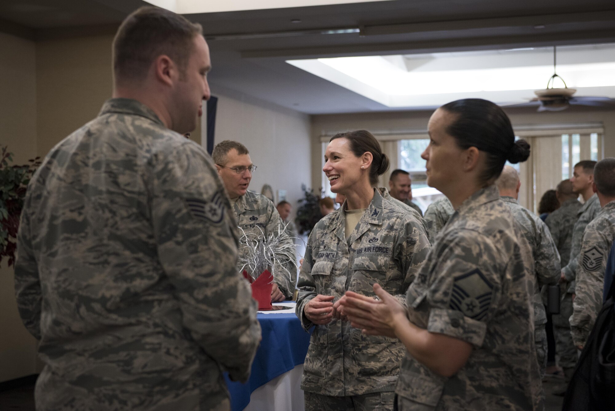 Col. Susan Riordan-Smith, 23d Mission Support Group commander, socializes with in-processing Airmen, Feb. 23, 2017, at Moody Air Force Base, Ga., during the in-processing program known as “On-boarding.” Airmen and families received a mission brief, had breakfast with leadership and took a tour of the base. (U.S. Air Force photo by Airman 1st Class Lauren M. Sprunk)