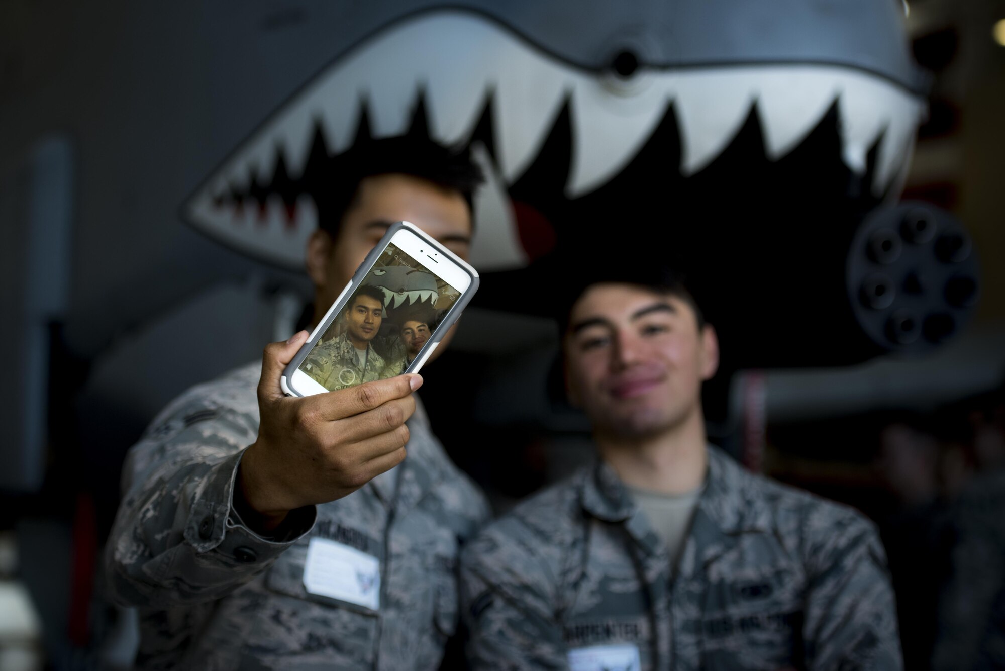 Airman 1st Class Charleston Lakandula, left, and Airman 1st Class Tyler Carpenter, right, 823d Base Defense Squadron fireteam members, take a selfie with an A-10C Thunderbolt II, Feb. 23, 2017, at Moody Air Force Base, Ga. Both Airmen were participants in Moody’s new “On-boarding” program, created to provide in-processing Airmen with information such as housing locations, leisure activities, etc. (U.S. Air Force photo by Airman 1st Class Lauren M. Sprunk)
