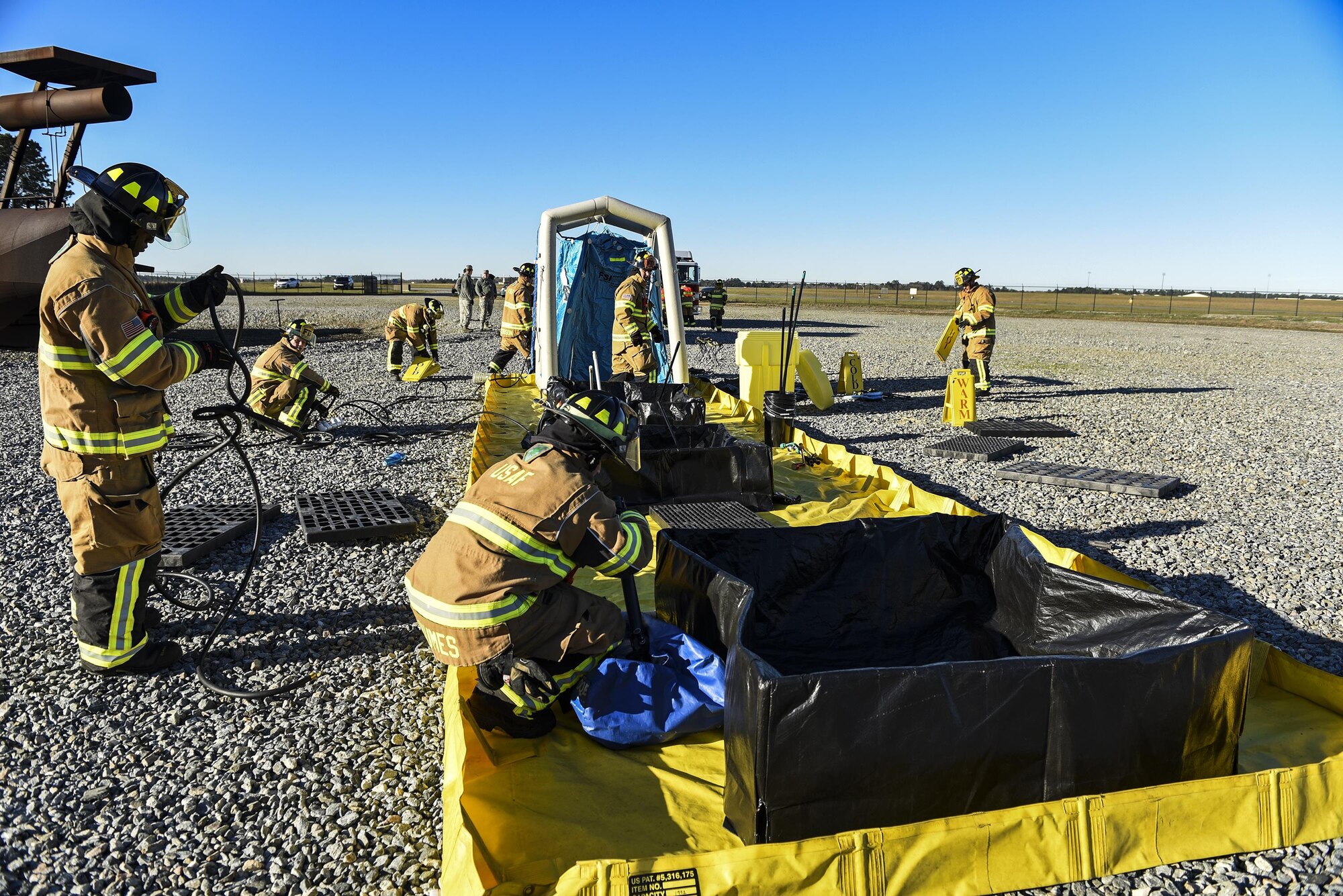 Firefighters from the 23d Civil Engineer Squadron put together a decontamination wash pit during a chemical, biological, radiological and nuclear defense exercise, Feb. 16 2017, at Moody Air Force Base, Ga. Moody’s Wing Inspection Team tested the 23d CES fire department, emergency management flight and bioenvironmental flight on procedures, response and effective communication between the units. (U.S. Air Force photo by Airman 1st Class Janiqua P. Robinson)