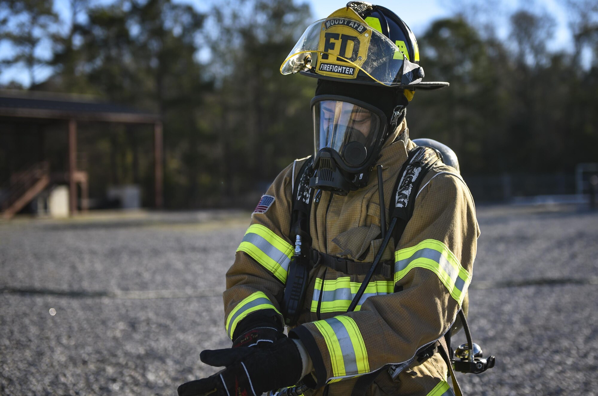 Airman Tyrell Thompson, 23d Civil Engineer Squadron firefighter, finishes donning protective gear during a chemical, biological, radiological and nuclear defense exercise, Feb. 16 2017, at Moody Air Force Base, Ga. Moody’s Wing Inspection Team tested the 23d CES fire department, emergency management flight and bioenvironmental flight on procedures, response and effective communication between the units. (U.S. Air Force photo by Airman 1st Class Janiqua P. Robinson)