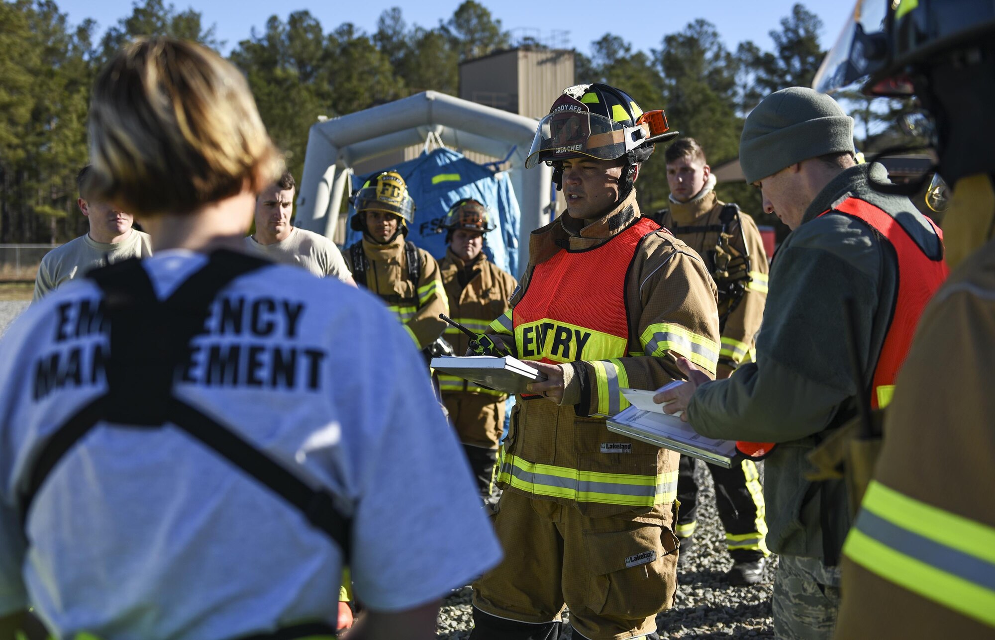 Mathew Perreira, 23d Civil Engineer Squadron firefighter, briefs participants during a chemical, biological, radiological and nuclear defense exercise, Feb. 16, at Moody Air Force Base, Ga. Moody’s Wing Inspection Team tested the 23d CES fire department, emergency management flight and bioenvironmental flight on procedures, response and effective communication between the units. (U.S. Air Force photo by Airman 1st Class Janiqua P. Robinson)