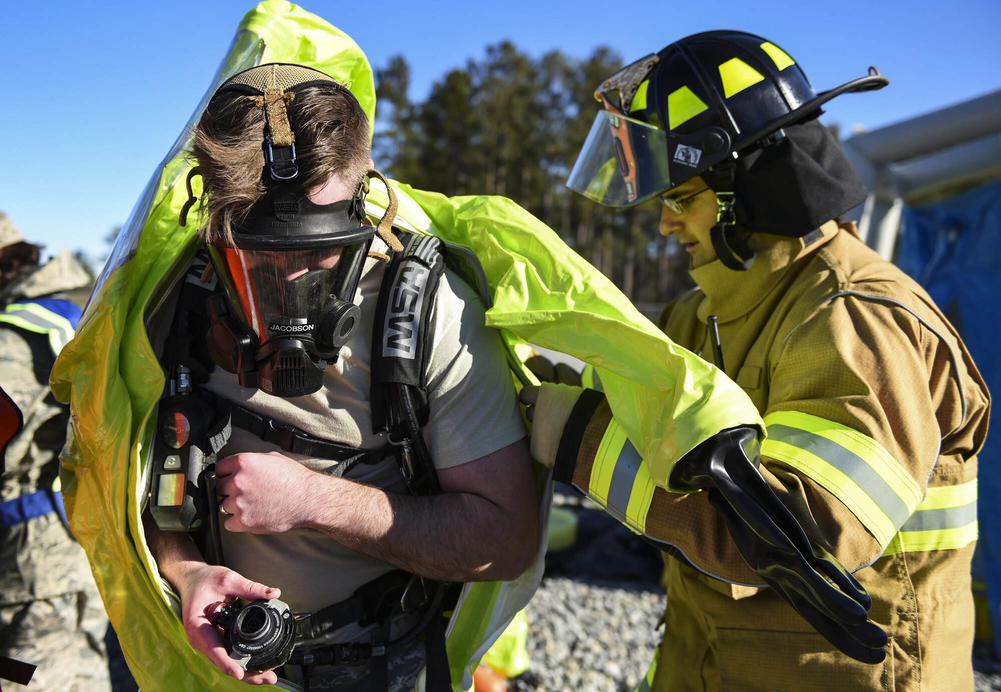 Staff Sgt. Benjamin Jacobson dons a hazardous material protective suit, during a chemical, biological, radiological and nuclear defense exercise, Feb. 16, at Moody Air Force Base, Ga. Moody’s Wing Inspection Team tested the 23d CES fire department, emergency management flight and bioenvironmental flight on procedures, response and effective communication between the units. (U.S. Air Force photo by Airman 1st Class Janiqua P. Robinson)