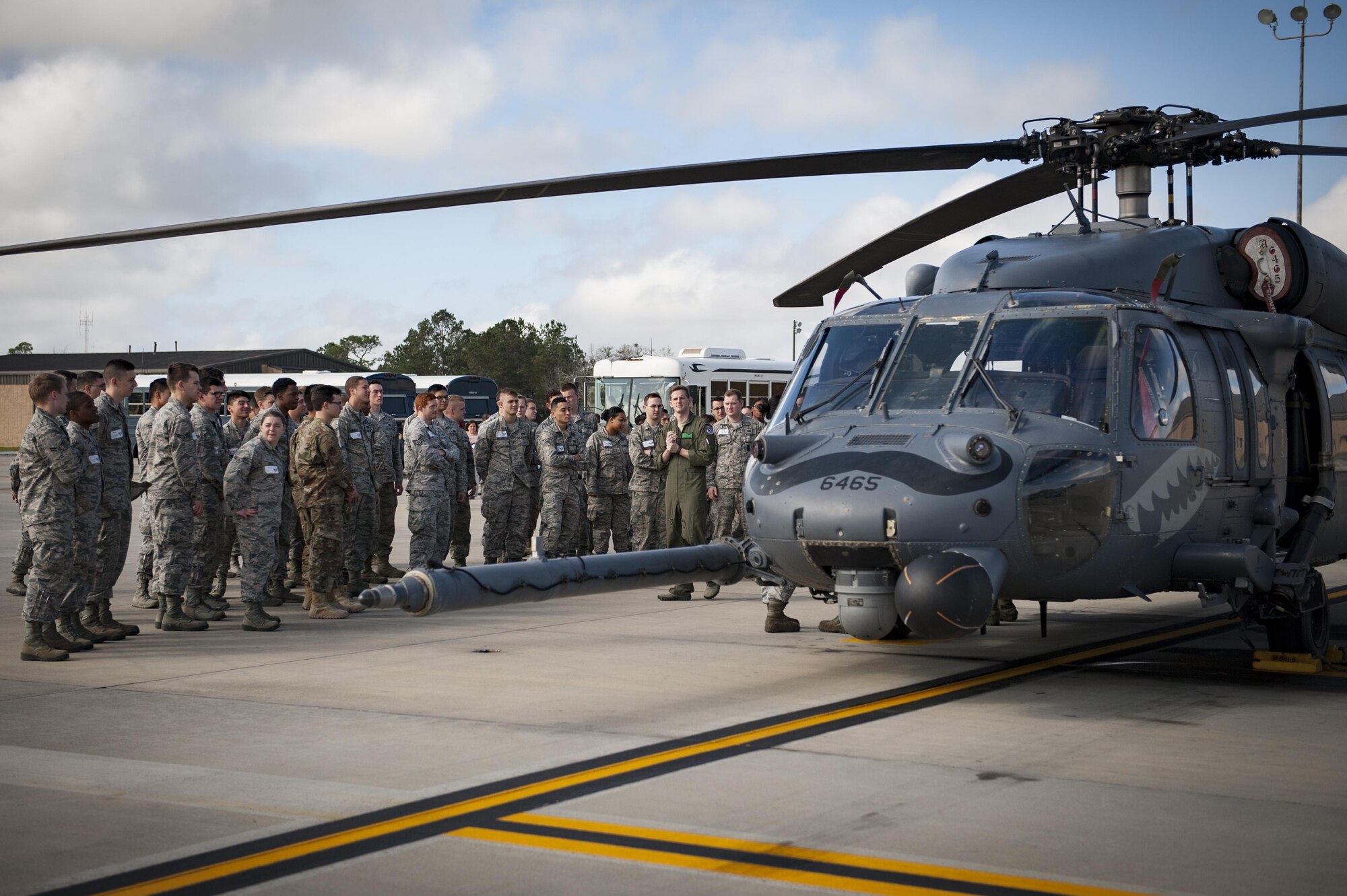 Capt. Jesse Reynolds, 41st Rescue Squadron co-pilot, briefs Airmen and families about the capabilities of the 41st RQS and the HH-60G Pave Hawk, Feb. 23, 2017, at Moody Air Force Base, Ga. This briefing was part of Moody’s new “On-boarding” program which welcomes in-processing Airmen to the base by providing them with information about the base and outside community. (U.S. Air Force photo by Airman 1st Class Lauren M. Sprunk)