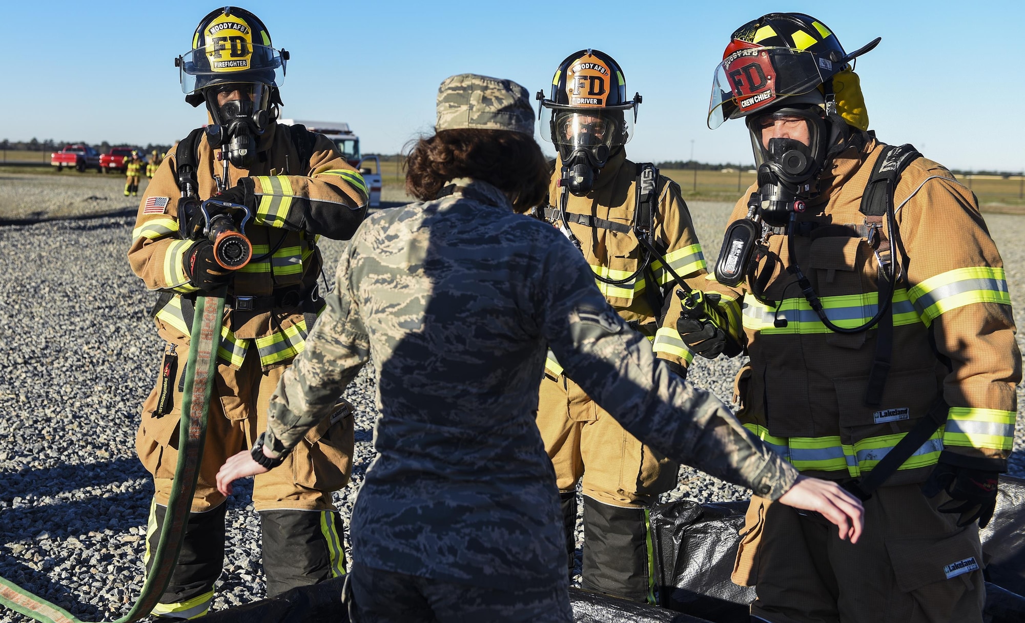 Firefighters from the 23d Civil Engineer Squadron simulate decontaminating an injured Airman during a chemical, biological, radiological and nuclear defense exercise, Feb. 16 2017, at Moody Air Force Base, Ga. Moody’s Wing Inspection Team tested the 23d CES fire department, emergency management flight and bioenvironmental flight on procedures, response and effective communication between the units. (U.S. Air Force photo by Airman 1st Class Janiqua P. Robinson)