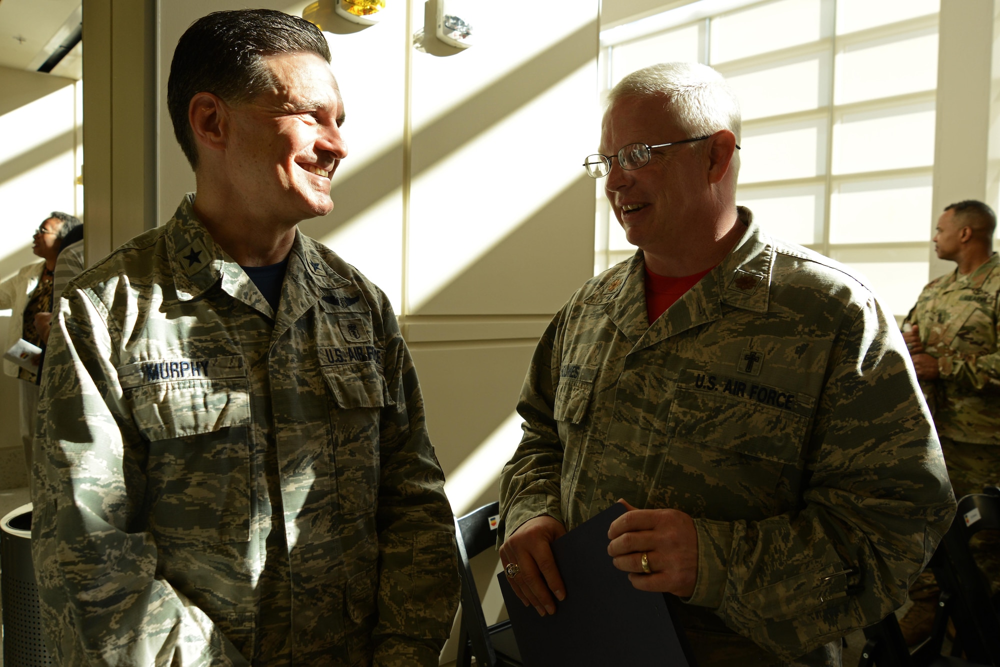U.S. Air Force Brig. Gen. (Dr.) Sean Murphy, Air Combat Command surgeon general, left, and Chaplain (Maj.) Richard Holmes, 20th Fighter Wing deputy chaplain, right, converse after a ribbon cutting ceremony for the new 20th Medical Group clinic at Shaw Air Force Base, S.C., Feb. 24, 2017. Holmes participated in the ceremony by giving the invocation. (U.S. Air Force photo by Airman 1st Class Kathryn R.C. Reaves)