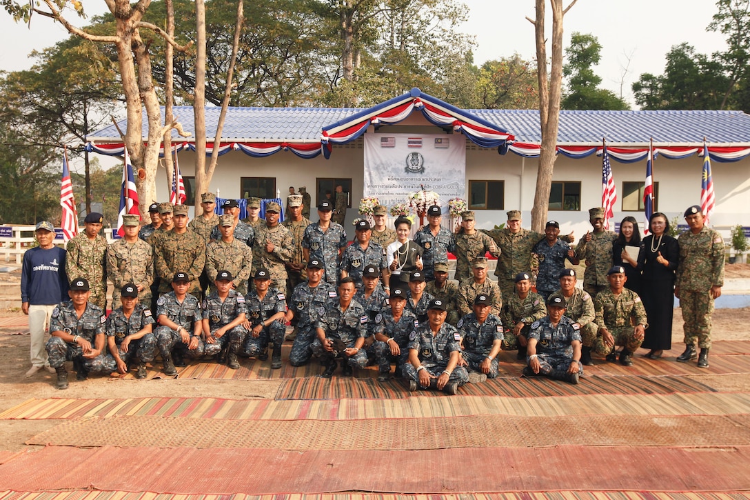 Service members from the United States, Thailand and Malaysia attend a site dedication ceremony at Ban Kok Kee San Toor, Khon Kaen Province, Thailand, during exercise Cobra Gold, Feb. 22, 2017. Cobra Gold, in its 36th iteration, focuses on humanitarian civic action, community engagement, and medical activities to support the needs and humanitarian interest of civilian populations around the region.