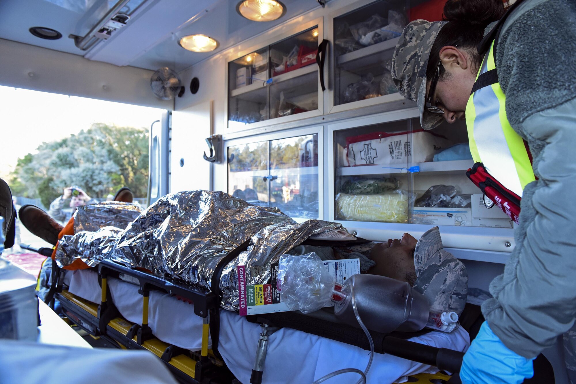 An Airman from the 23d Medical Group provides care to a simulated casualty during a chemical, biological, radiological and nuclear defense exercise, Feb. 16 2017, at Moody Air Force Base, Ga. The MDG responded to the exercise, providing on scene treatment and care after transporting injured Airmen off scene. (U.S. Air Force photo by Airman 1st Class Janiqua P. Robinson)