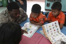 U.S. Air Force Staff Sgt. Elmore Norwood, aircraft structural maintenance technician, 8th Maintenance Squadron, interacts with children at Ban Nong Pet Nam, Korat Province, Thailand, during exercise Cobra Gold, Feb. 21, 2017. Cobra Gold, in its 36th iteration, focuses on humanitarian civic action, community engagement, and medical activities to support the needs and humanitarian interest of civilian populations around the region. 