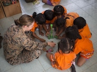 Service members from the United States and Thailand interact with children at Ban Nong Pet Nam, Korat Province, Thailand, during exercise Cobra Gold, Feb. 21, 2017. Cobra Gold 17 maintains a consistent focus on humanitarian civic action, community engagement, and medical activities conducted during the exercise to support the needs and humanitarian interests of civilian populations around the region. 
