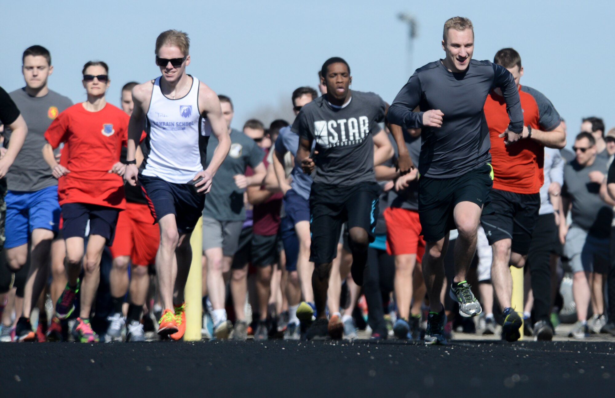 Runners from the National Air and Space Intelligence Center take off from
the starting line during the unit's fourth annual Polar Bear Run Friday,
Feb. 17, 2017. Despite its name, the event was conducted on a day when
temperatures reached the mid-60s temperatures. The Center's Enlisted
Advisory Council sponsors the run as a fundraiser for special events. (U.S.
Air Force photo by Senior Airman Jonathan Stefanko)