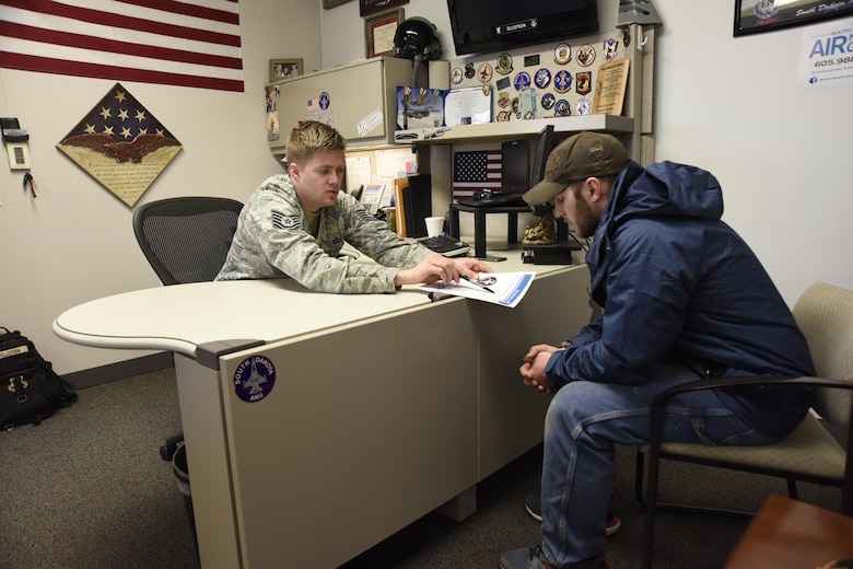 SIOUX FALLS, S.D. - Tech Sgt. Bo Ellefson, 114th Fighter Wing recruiter, speaks with James Kurtenbach, Sioux Falls native, about the benefits of membership in the South Dakota Air National Guard. Ellefson is part of a five-person recruiting team who spread awareness of the South Dakota Air National Guard mission and the benefits of joining. (U.S. Air National Guard photo by Staff Sgt. Duane Duimstra/Released)