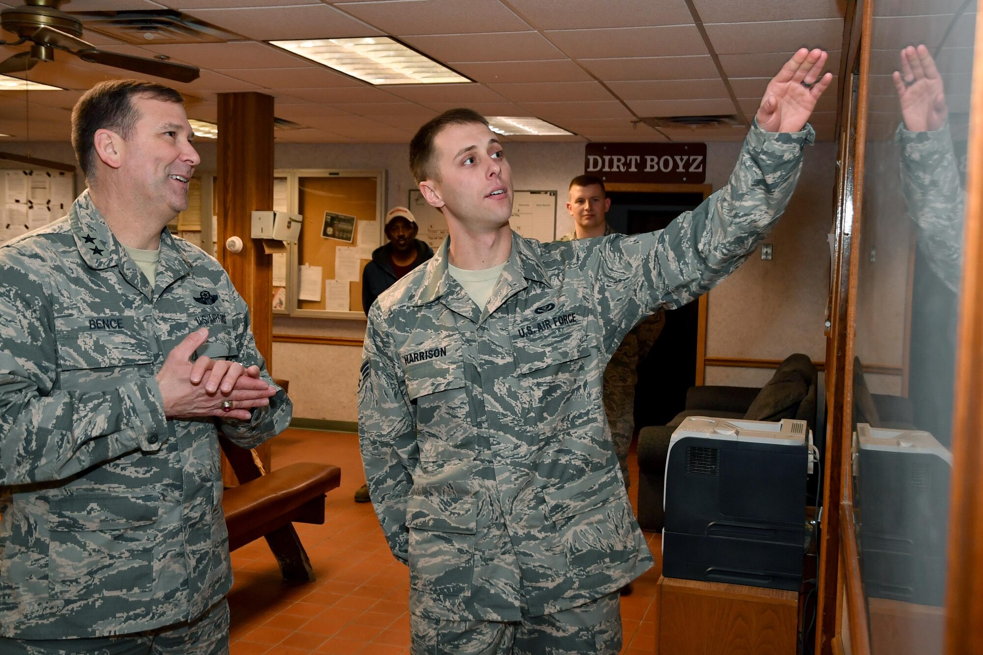 Maj. Gen. Christopher Bence, Expeditionary Center commander, listens to Senior Airman Dylan Harrison, 319th Civil Engineer Squadron pavement and equipment apprentice, explain the action routes for road maintenance in the winter on Grand Forks Air Force Base, N.D., Feb. 23, 2017. EC leadership visited Grand Forks AFB to gain first-hand knowledge of mission operations and Airmen readiness. (U.S. Air Force photo by Airman 1st Class Elijaih Tiggs)