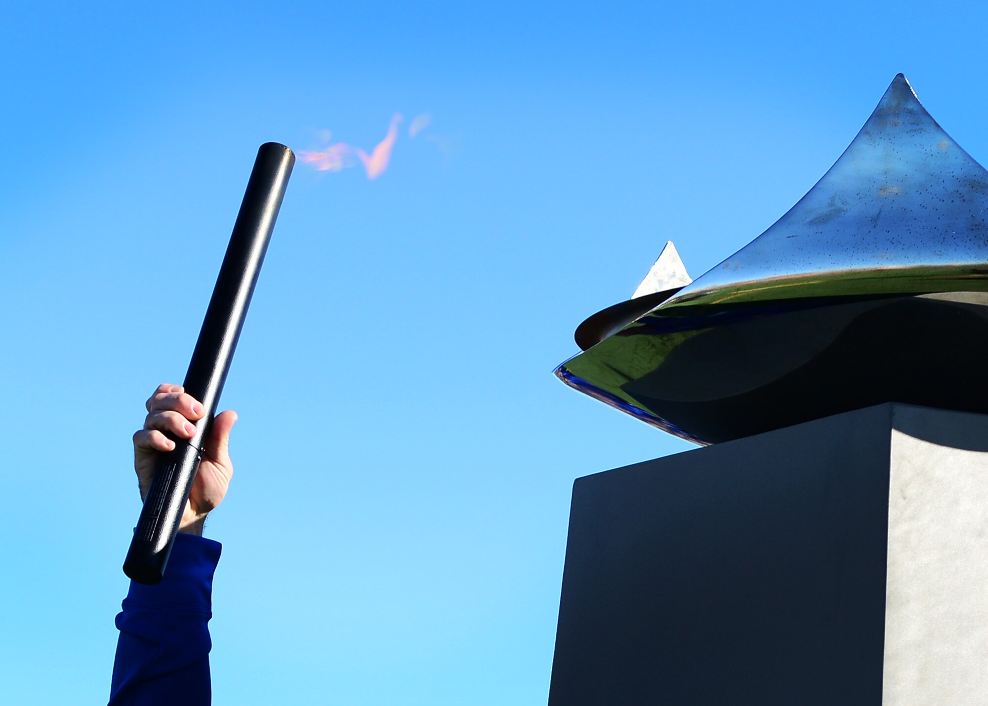 U.S. Air Force Tech. Sgt. Jason Caswell, 2017 AF Warrior Game Trials competitor, lights the cauldron during the 2017 Air Force Warrior Game Trials opening ceremony outside the Warrior Fitness Center Feb. 24, 2017 at Nellis Air Force Base, Nev. These trials are part of an adaptive sports program, headed by the Wounded Warrior Program, designed to promote the mental and physical wellbeing of seriously wounded, ill and injured military members and veterans. (U.S. Air Force photo by Senior Airman Chip Pons)