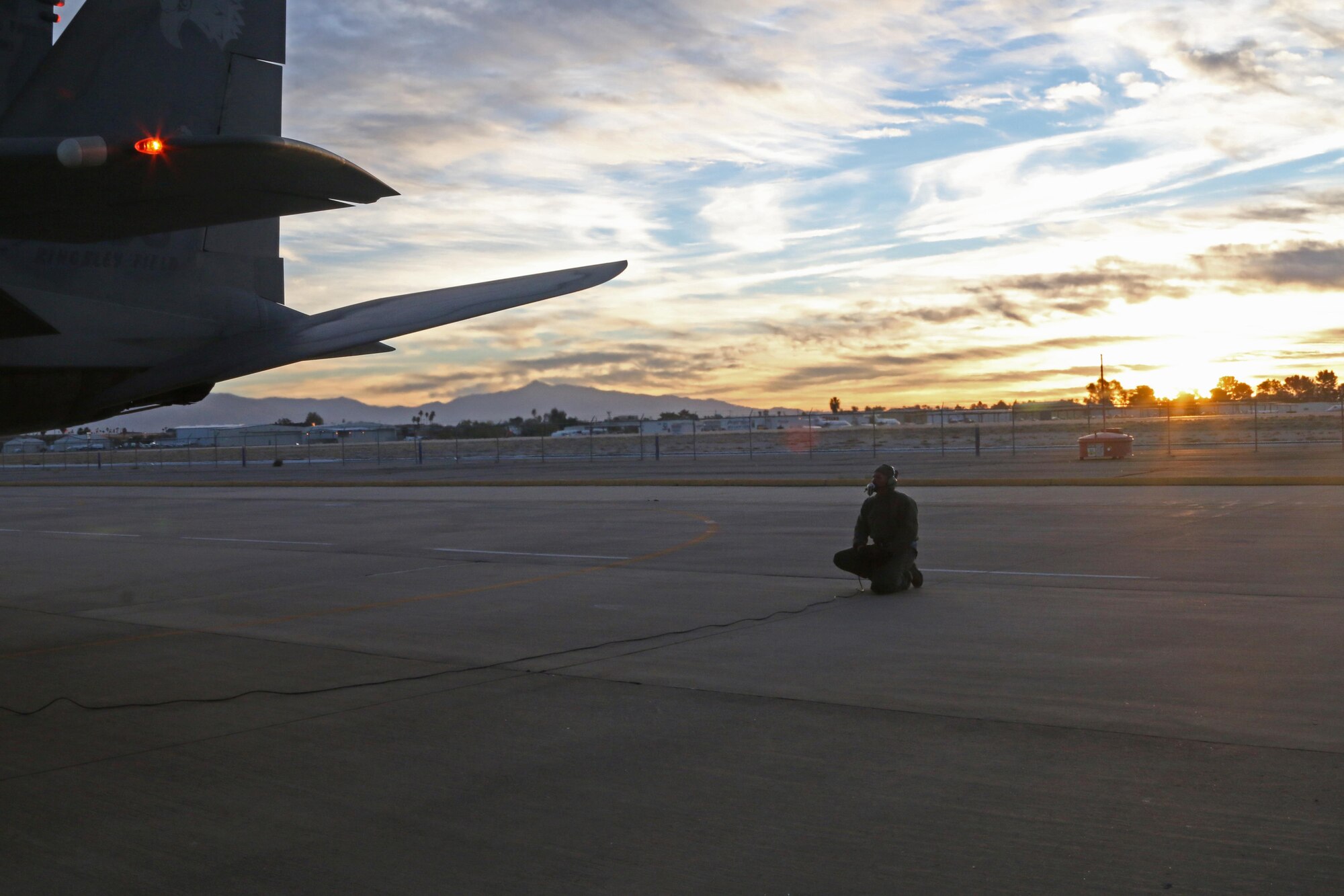 U.S. Air Force Staff Sgt. Joseph Schlotthauer, 173rd Fighter Wing F-15 Crew Chiefs, preflights an F-15 Eagle in preperation for a training flight at Tucson, Arizona January 12, 2017.  The 173rd Fighter Wing spent two weeks training with the 162nd Wing, Airzona Air National Guard, flying dissimilar air combat training with their F-16s.  (U.S. Air National Guard photo by Master Sgt. Jennifer Shirar)