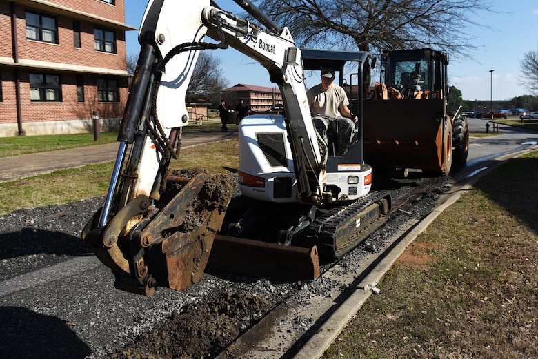 U.S. Air Force Senior Airman Tylor Toby, 19th Civil Engineer Squadron pavement and heavy equipment craftsman, excavates clay and dirt during a road repair project Jan. 7, 2017, at Little Rock Air Force Base, Ark. Airmen of the pavements and heavy equipment shop are also known as “Dirt Boyz”, for their close relationship with grimy terrain and messy construction materials. (U.S. Air Force photo by Airman 1st Class Kevin Sommer Giron)