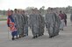 Cadets from Auburn University’s Air Force ROTC Detachment march an Auburn flag from Aircraft Tail Number 85-0040 known as "War Eagle" to Aircraft Tail Number 91-9142 during a Transfer of Heritage ceremony Feb. 24, at Maxwell Air Force Base.  Aircraft 91-9142, which will now carry the “War Eagle” legacy, came to the 908th Airlift Wing at Maxwell from the 914th Airlift Wing at Niagara Falls Air Reserve Station, New York. (U.S. Air Force photo by Bradley J. Clark)